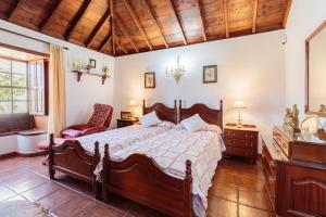 Ein Bett oder Betten in einem Zimmer der Unterkunft El Sitio La Rosa
