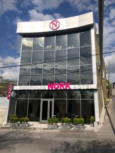a sign on the front of a nk building at Nork Hotel in Yerevan