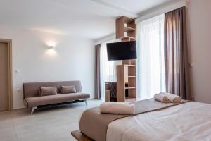 Postel nebo postele na pokoji v ubytování Galaxy Hotel