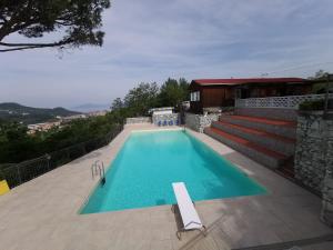 a swimming pool on top of a house at Camping Mare Monti in Sestri Levante