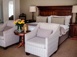 A bed or beds in a room at Cinnamon Boutique Guest House