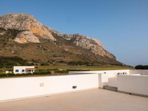 a view of a mountain from a white wall at Casa Vigna in Favignana