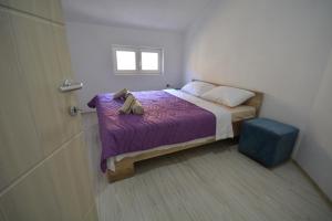 En eller flere senger på et rom på Luna Apartments Gevgelija