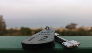 a remote control sitting on top of a green table at Summer Sun in Skala