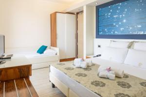 Postel nebo postele na pokoji v ubytování Hotel Porta Rosa