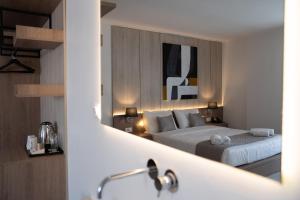 Postel nebo postele na pokoji v ubytování Galaxy Hotel