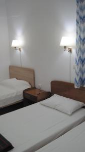 Postel nebo postele na pokoji v ubytování Tatsis Apartments