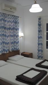 Postel nebo postele na pokoji v ubytování Tatsis Apartments