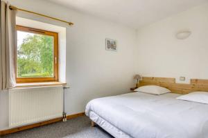 Postel nebo postele na pokoji v ubytování Gîte Les 4 Saisons
