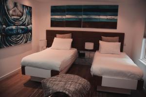 Ένα ή περισσότερα κρεβάτια σε δωμάτιο στο Hotel 55