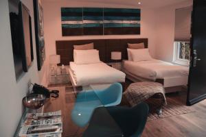 Ένα ή περισσότερα κρεβάτια σε δωμάτιο στο Hotel 55
