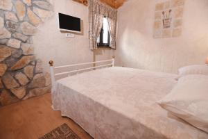 Posteľ alebo postele v izbe v ubytovaní House & Apartment Palača + 37 fotografií