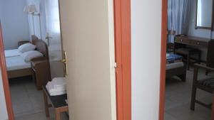 Postel nebo postele na pokoji v ubytování Tatsis Apartments