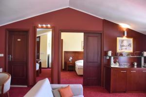 a living room with a couch and a bedroom at Villa Riva in Makarska
