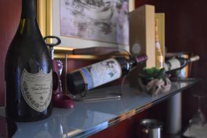 a bottle of wine sitting on a shelf at Villa Riva in Makarska