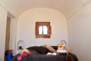 Posteľ alebo postele v izbe v ubytovaní I Dammusi Sapori di Pantelleria
