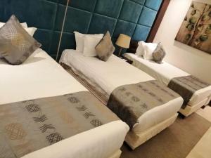 Letto o letti in una camera di Three Points Al Salama