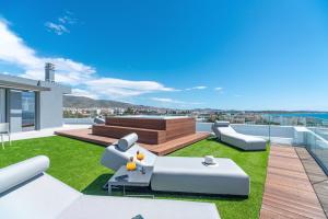 an image of a rooftop patio with grass at Glyfada Riviera Hotel in Athens