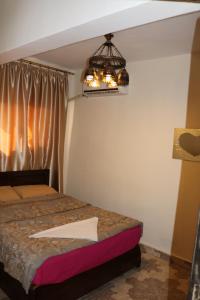 A bed or beds in a room at Wake Up! Cairo Hostel