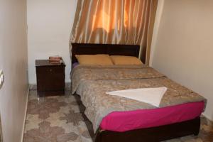 A bed or beds in a room at Wake Up! Cairo Hostel