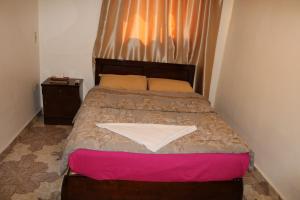 A bed or beds in a room at Wake Up! Cairo Hostel