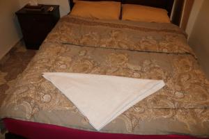 A bed or beds in a room at Wake Up! Cairo Hostel