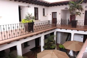 an external view of a building with umbrellas at Hotel Casa las Mercedes in Oaxaca City