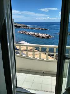 a view of the ocean from a window at La casa Verde in Ischia