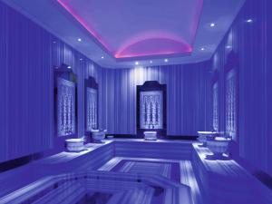 a purple room with toilets and a bath tub at Hotel Grand Kaptan - Ultra All Inclusive in Alanya