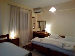 Posteľ alebo postele v izbe v ubytovaní Ostria Maisonettes and Studios
