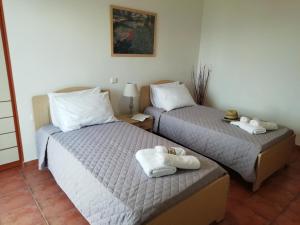 A bed or beds in a room at Melissani House