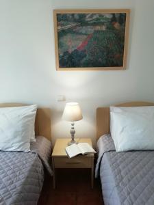 A bed or beds in a room at Melissani House