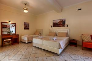 Postel nebo postele na pokoji v ubytování Angelica Hotel
