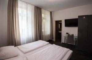Postel nebo postele na pokoji v ubytování Hotel Luisenhof