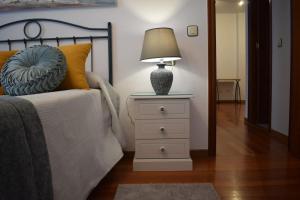 A bed or beds in a room at El Pozu las Ranas