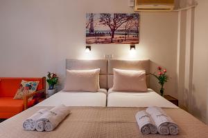 Postel nebo postele na pokoji v ubytování Angelica Hotel