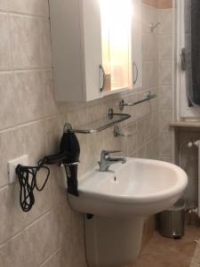 a bathroom with a sink and a mirror at IL CAPRICCIO DI SILVIA in Sirmione +25 photos