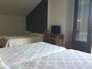 Posteľ alebo postele v izbe v ubytovaní Hotel Cinco Castaños