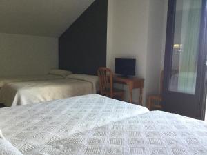Posteľ alebo postele v izbe v ubytovaní Hotel Cinco Castaños
