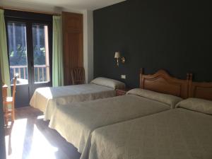 Posteľ alebo postele v izbe v ubytovaní Hotel Cinco Castaños