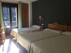 Posteľ alebo postele v izbe v ubytovaní Hotel Cinco Castaños