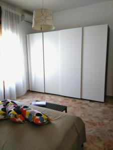 A bed or beds in a room at Appartamento Il Mandorlo - Custonaci