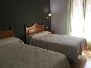 Posteľ alebo postele v izbe v ubytovaní Hotel Cinco Castaños