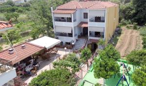 an aerial view of a house with a swimming pool at studio nufaro in Mytilene