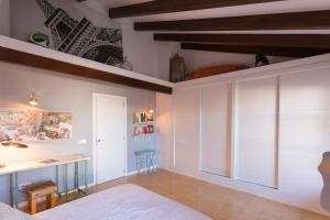A bed or beds in a room at POC A POC SUITES