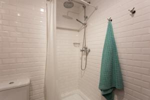 A bathroom at POC A POC SUITES