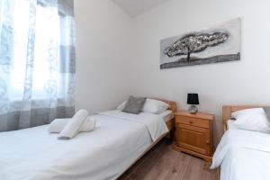Postel nebo postele na pokoji v ubytování Apartment Anđela