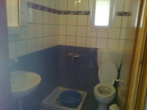 a bathroom with a toilet and a sink at House Mantesos in Koinyra +43 photos