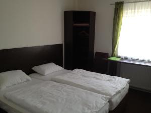 Postel nebo postele na pokoji v ubytování Motel R10