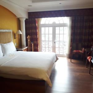 Ένα ή περισσότερα κρεβάτια σε δωμάτιο στο Villas Princess Hotel